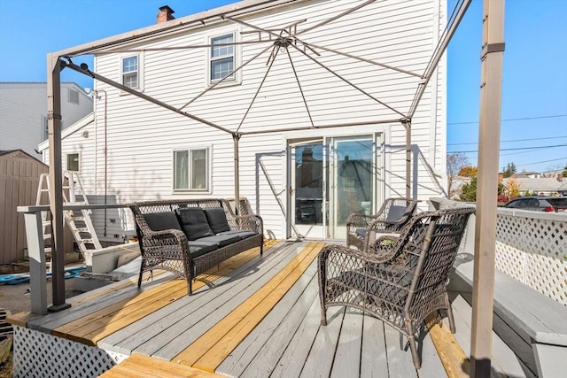 wooden deck featuring an outdoor living space