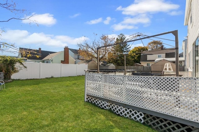 view of yard featuring a storage unit