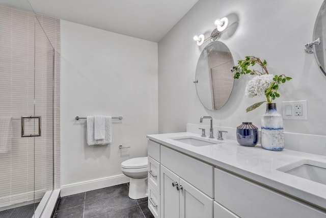 bathroom featuring double vanity, a sink, a shower stall, tile patterned floors, and toilet