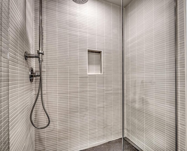 details featuring a tile shower