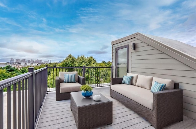 deck with an outdoor living space and a view of city