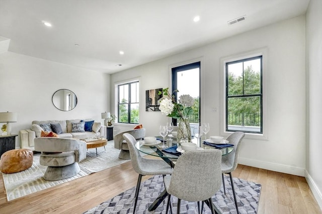 dining area with visible vents, recessed lighting, baseboards, and wood finished floors