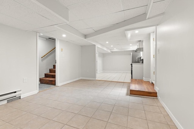 651 S Main St, Randolph, MA 02368 - finished basement featuring light tile patterned floors, recessed lighting, stairs, baseboard heating, and a drop ceiling