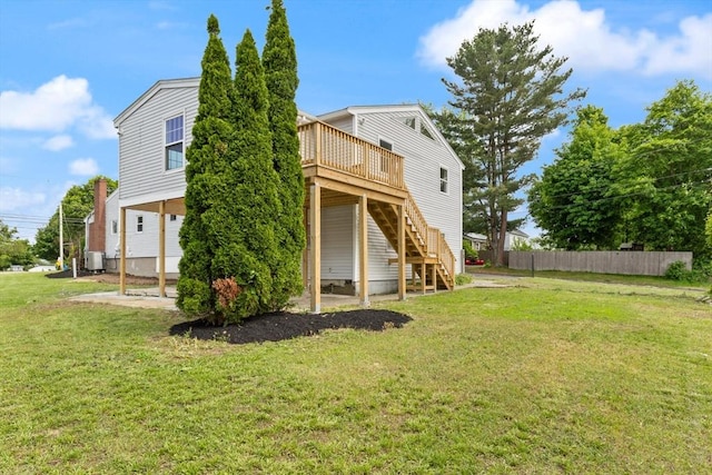 651 S Main St, Randolph, MA 02368 - rear view of house with stairway, a wooden deck, and cooling unit