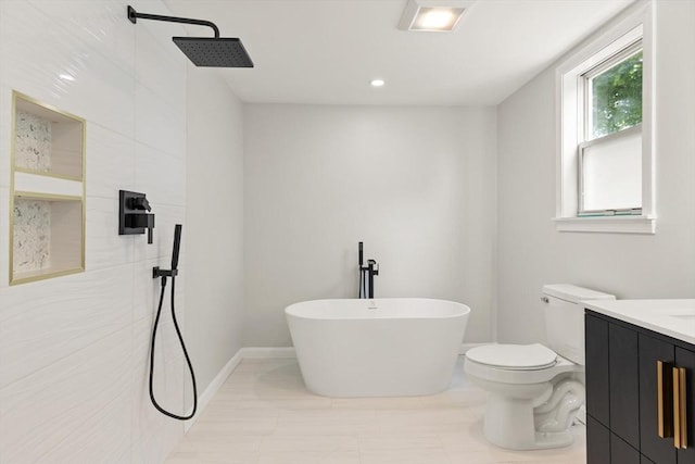 651 S Main St, Randolph, MA 02368 - full bathroom featuring a freestanding bath, vanity, toilet, and a shower