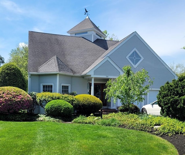 244 Salem End Rd, Framingham, MA 01702 - view of front of home with a front lawn and a shingled roof