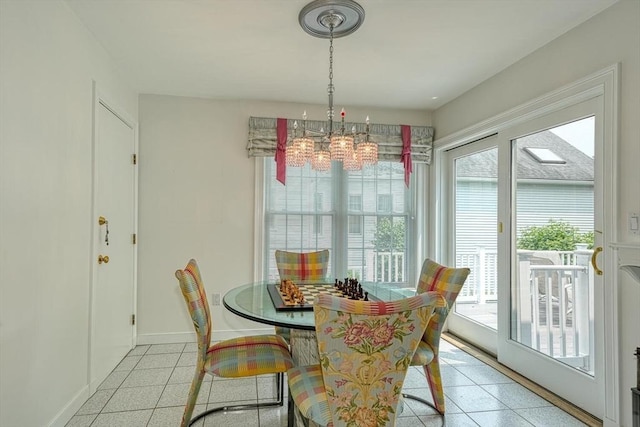 244 Salem End Rd, Framingham, MA 01702 - dining area with a chandelier, baseboards, and light tile patterned flooring