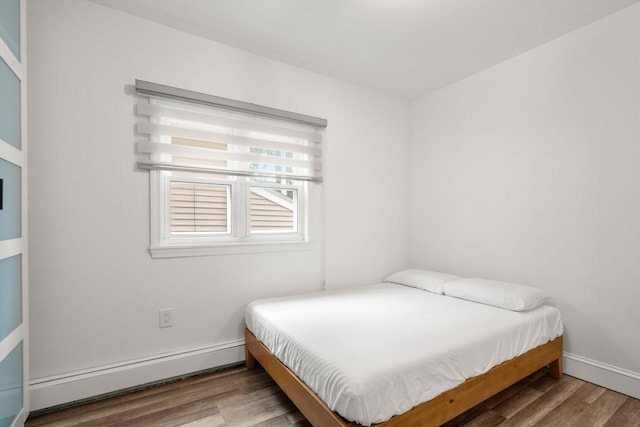 20 Pleasant View Ave, Everett, MA 02149 - bedroom featuring a baseboard radiator and wood finished floors