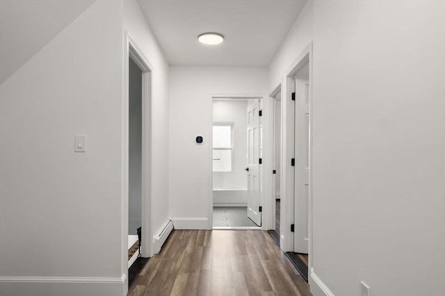 20 Pleasant View Ave, Everett, MA 02149 - hallway featuring dark wood-style floors and a baseboard radiator