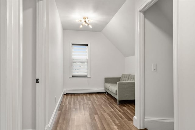 20 Pleasant View Ave, Everett, MA 02149 - unfurnished room featuring baseboard heating, wood finished floors, and lofted ceiling