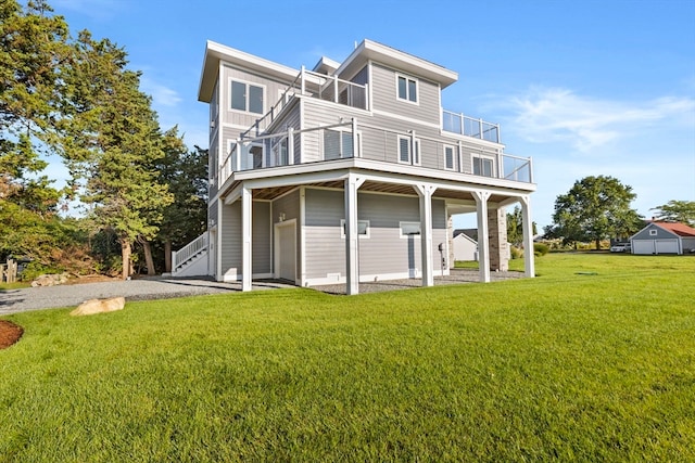 rear view of house with a yard