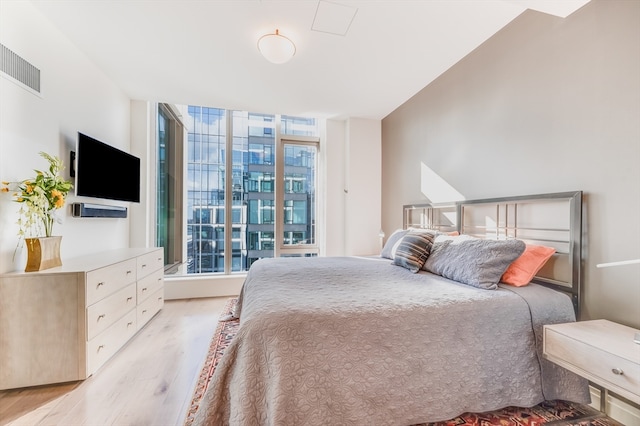 bedroom with light hardwood / wood-style flooring