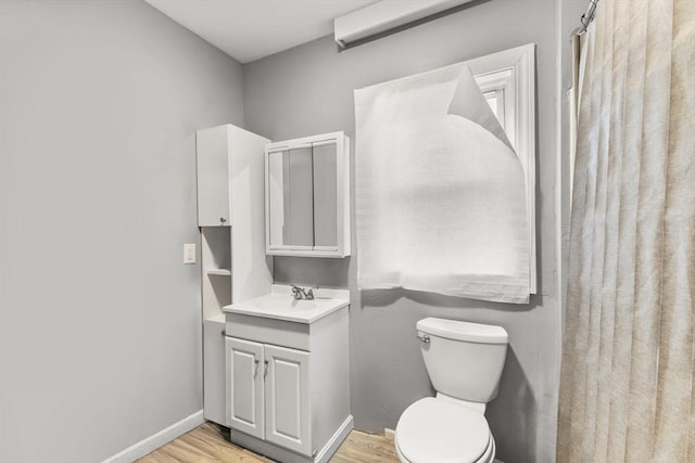 52 Adams St, Taunton, MA 02780 - bathroom with vanity, toilet, wood finished floors, baseboards, and a shower with curtain