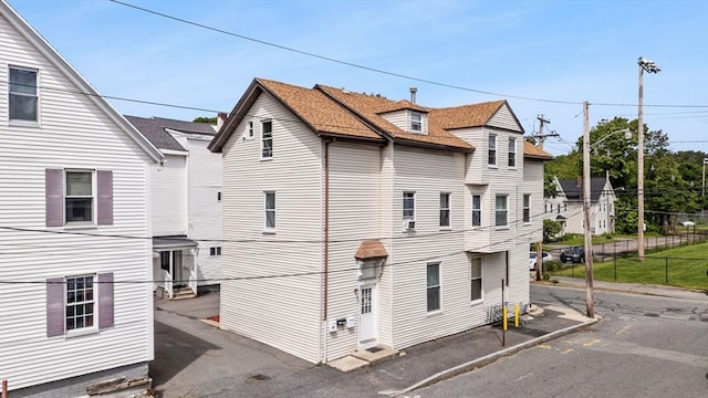 52 Adams St, Taunton, MA 02780 - view of side of home featuring entry steps and roof with shingles