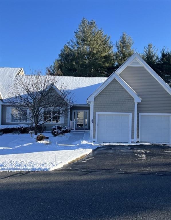 view of front facade with driveway and an attached garage