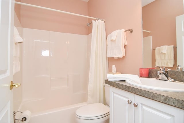 bathroom with shower / tub combo, vanity, and toilet