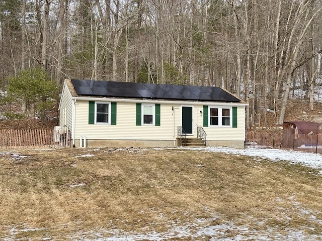 view of front of home featuring solar panels