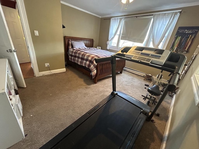 bedroom featuring a baseboard heating unit, crown molding, and carpet