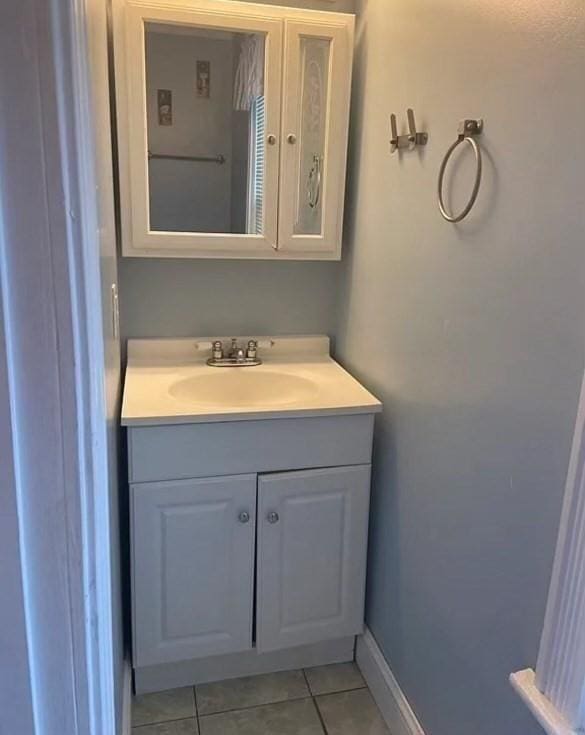 bathroom with vanity and tile patterned floors