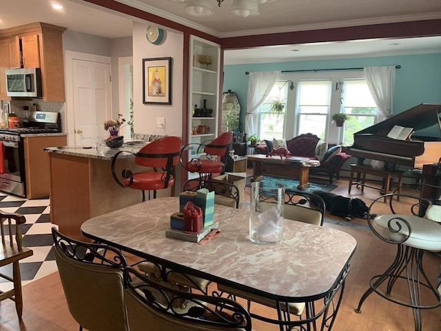 dining area featuring crown molding