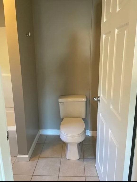 bathroom with tile patterned floors and toilet