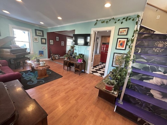 living room featuring crown molding and hardwood / wood-style floors