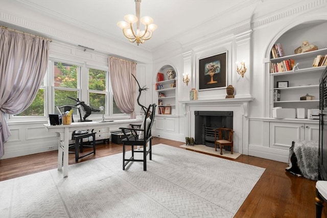 258-260 Beacon St Unit 4, Boston, MA 02116 - home office with built in features, wood finished floors, crown molding, a fireplace with flush hearth, and a chandelier