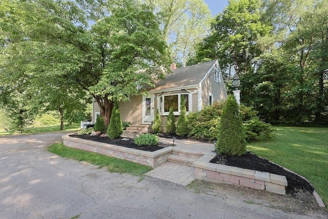 161 N Worcester St, Norton, MA 02766 - view of front of home featuring a chimney and a front lawn