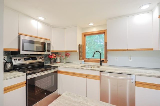 161 N Worcester St, Norton, MA 02766 - kitchen featuring stainless steel appliances, white cabinetry, backsplash, recessed lighting, and light stone countertops