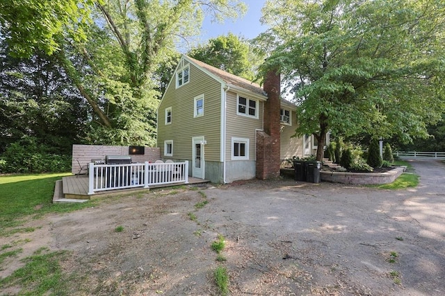 161 N Worcester St, Norton, MA 02766 - view of front of house with a chimney and a deck