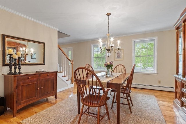 86 S Cross Rd, Haverhill, MA 01835 - dining area with a chandelier, a baseboard radiator, light wood-style flooring, plenty of natural light, and ornamental molding