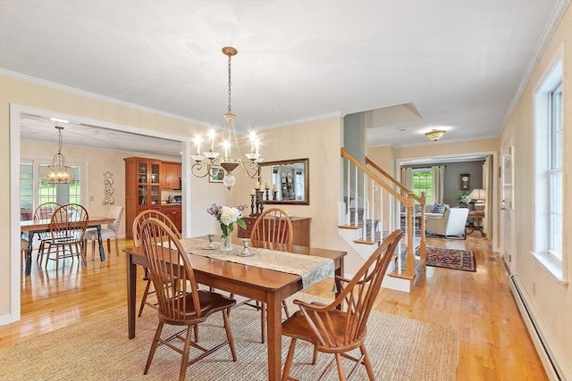 86 S Cross Rd, Haverhill, MA 01835 - dining room with a baseboard radiator, a chandelier, light wood-style floors, stairway, and crown molding