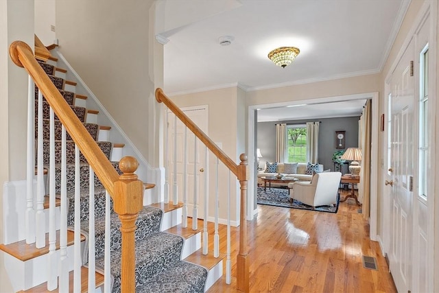 86 S Cross Rd, Haverhill, MA 01835 - entrance foyer featuring wood finished floors, ornamental molding, and stairway