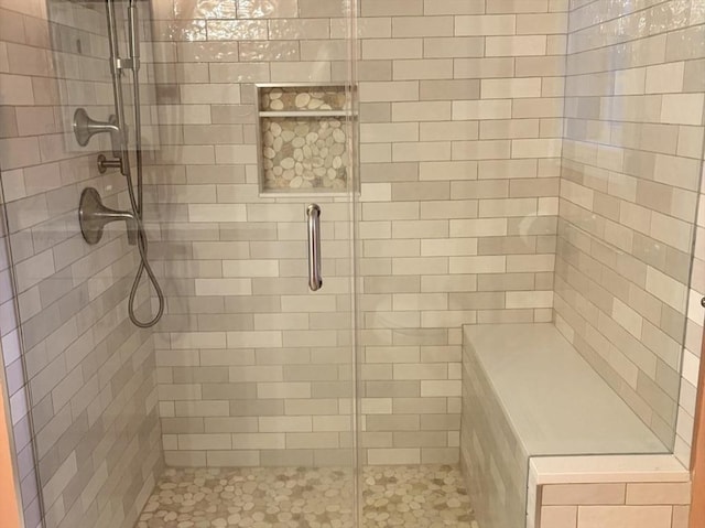 full bathroom featuring a shower stall