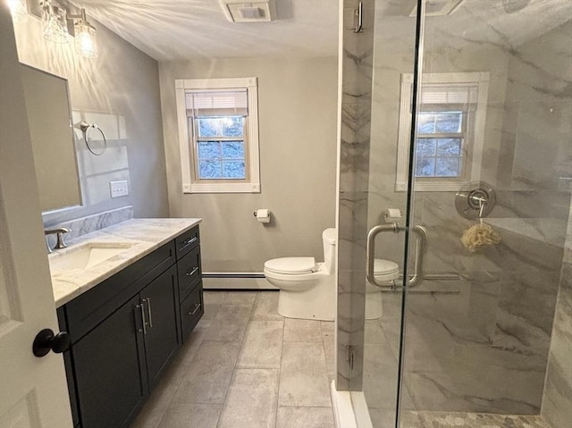 full bathroom featuring a marble finish shower, visible vents, baseboard heating, toilet, and vanity