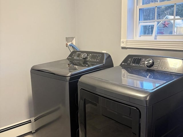 clothes washing area featuring washing machine and dryer and laundry area