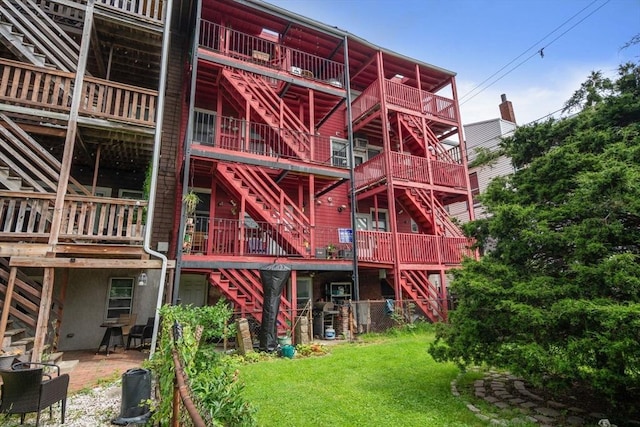267 Lexington St Unit 1, Boston, MA 02128 - rear view of property with stairway and a yard