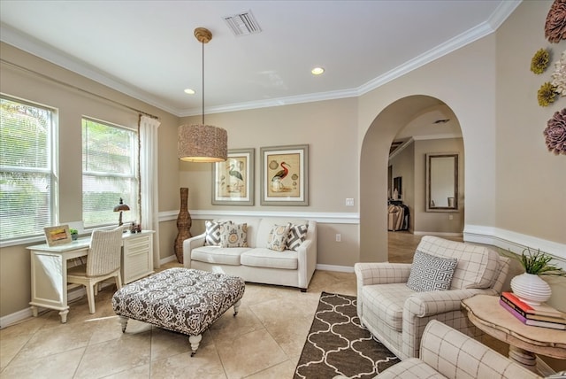 living room with ornamental molding and light tile patterned floors