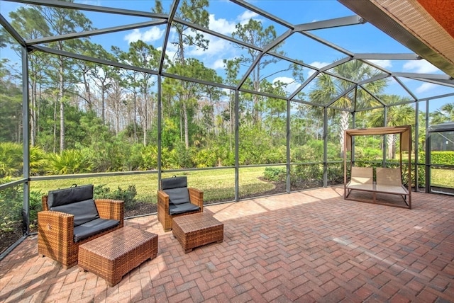 view of patio featuring a lanai