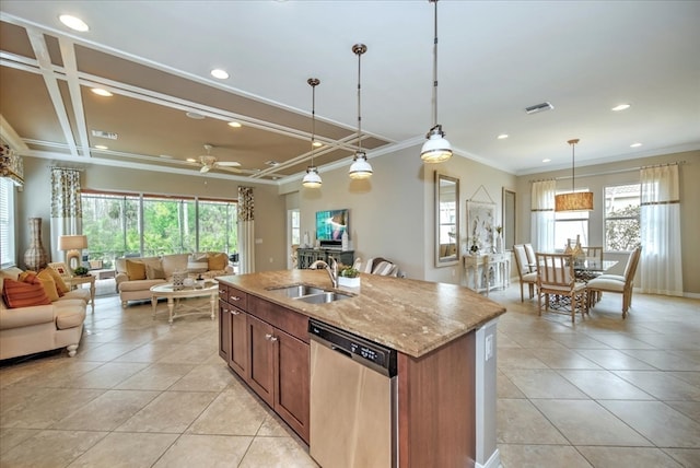 kitchen with sink, light stone counters, an island with sink, pendant lighting, and dishwasher