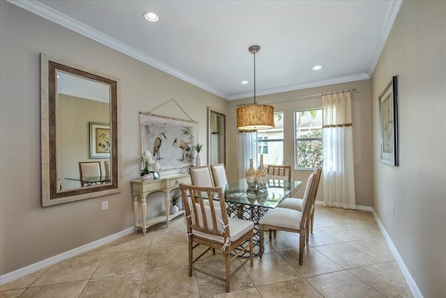 tiled dining area featuring ornamental molding