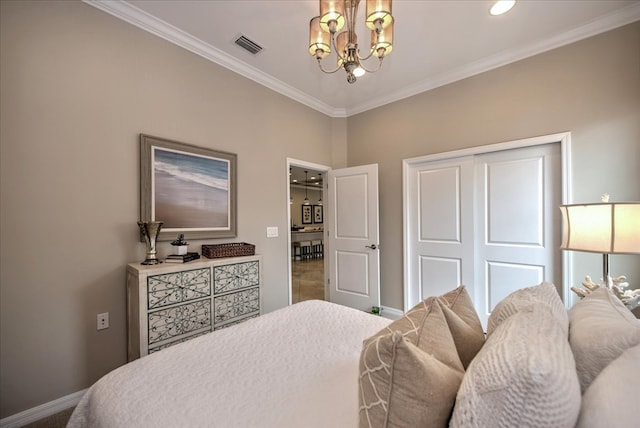 carpeted bedroom featuring a closet, crown molding, and a notable chandelier