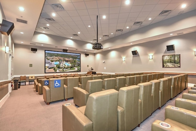 cinema featuring light colored carpet and a drop ceiling