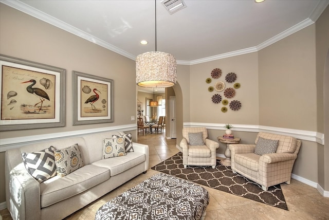 living room featuring light tile patterned floors and crown molding