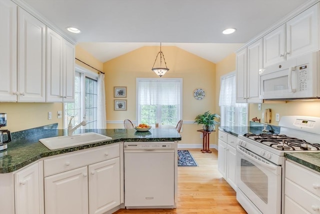 20 Crestview Cir, Barnstable, MA 02632 - kitchen featuring white appliances, a sink, vaulted ceiling, a peninsula, and white cabinets