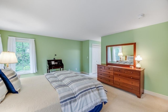20 Crestview Cir, Barnstable, MA 02632 - bedroom with baseboards, light carpet, and a closet