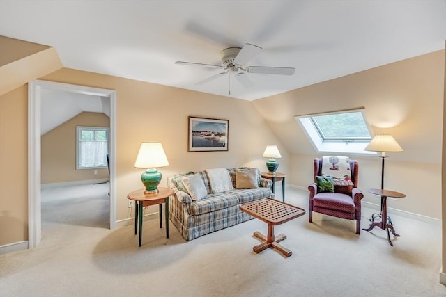 20 Crestview Cir, Barnstable, MA 02632 - living area with carpet flooring, vaulted ceiling, a skylight, a ceiling fan, and baseboards