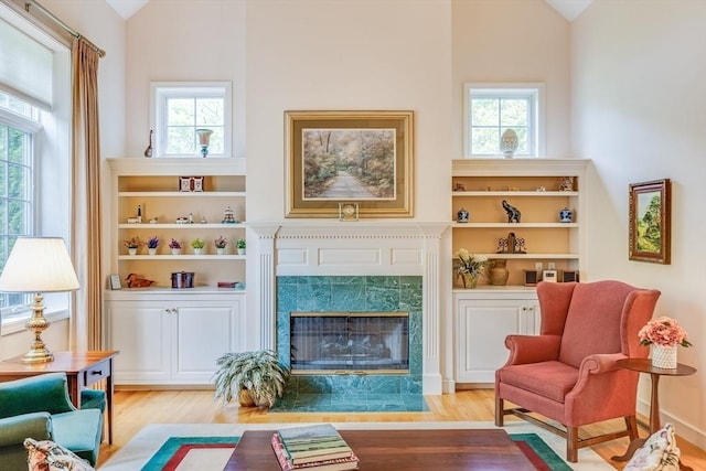 20 Crestview Cir, Barnstable, MA 02632 - living area with vaulted ceiling, wood finished floors, healthy amount of natural light, and a premium fireplace
