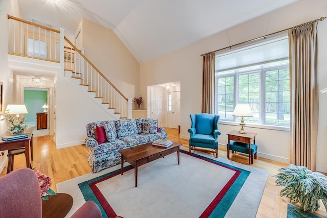 20 Crestview Cir, Barnstable, MA 02632 - living room with stairs, wood finished floors, high vaulted ceiling, and baseboards