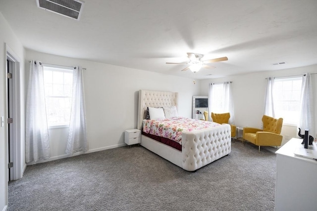 bedroom with multiple windows, carpet floors, and ceiling fan